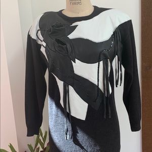 Vintage 80s sweater with leather appliqué.